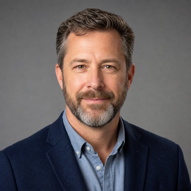 Professional headshot of Caleb Thompson